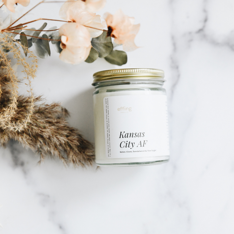 Kansas City AF. This wooden wick candle smells like clove, sandalwood, and winning. Proudly handmade in KC.