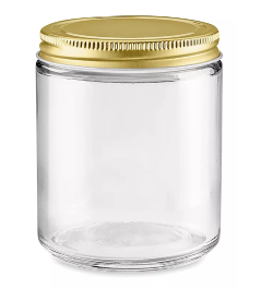 clear straight-sided candle jar with a gold lid